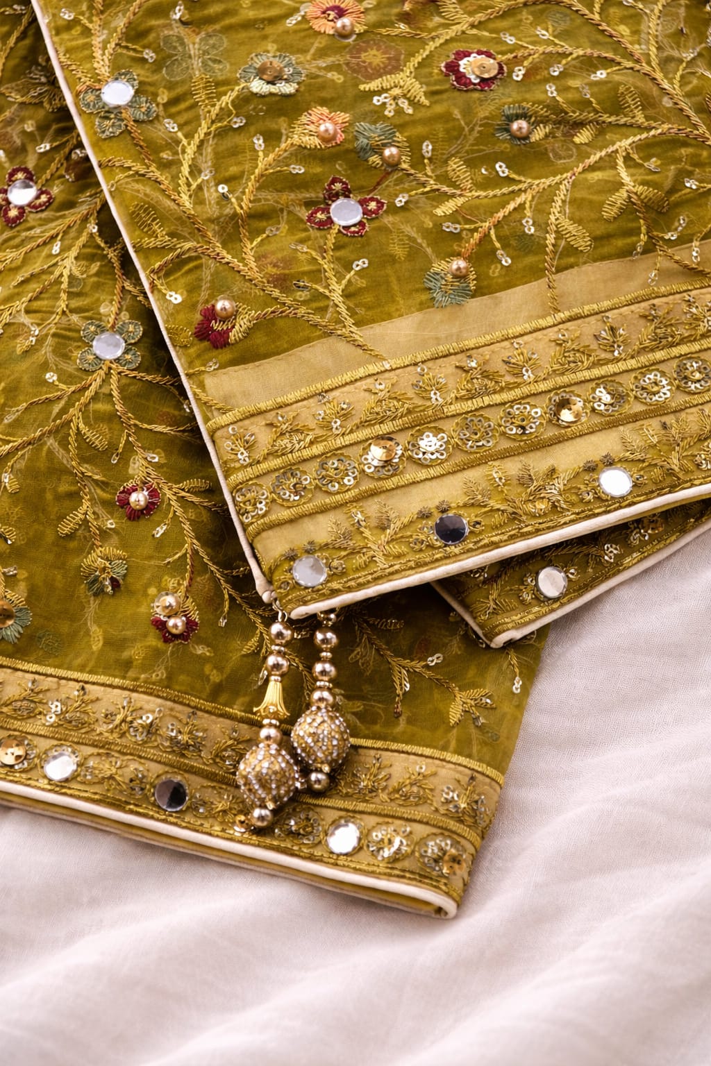 Premium Mehndi Green Organza Abstract With Sequin Mirror Work And Hand Made Tassels On Corner